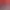 Lit avec une tête de lit bleu foncé et rouge, deux oreillers gris et deux oreillers rouges, deux lampes de chevet allumées et une table de nuit noire de chaque côté